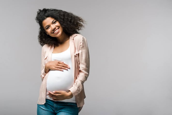 Young pregnant woman with healthy skin