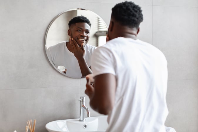 Man applying skincare for sensitive skin