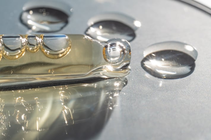 Close-up of skincare serum droplets highlighting hydration and skin barrier support