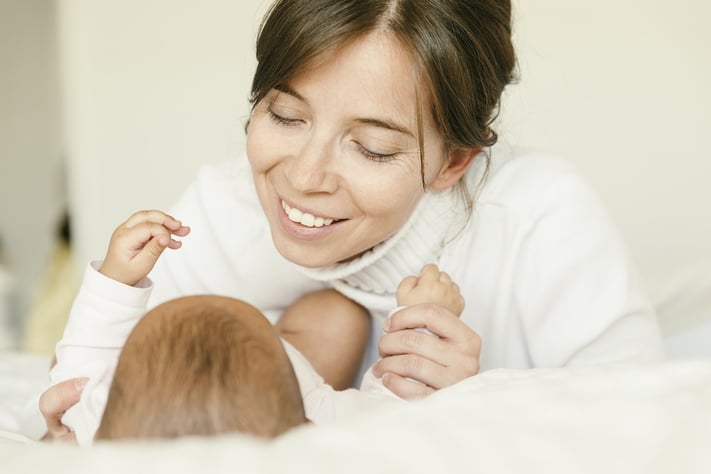 new mother looking at baby