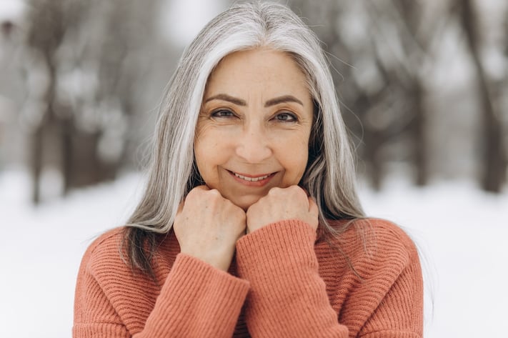 mature woman with gray hair smiling