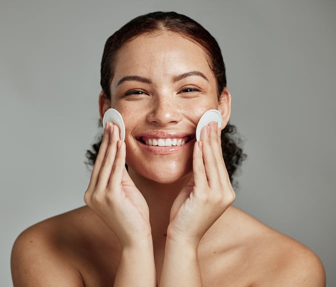 Woman using acne skincare