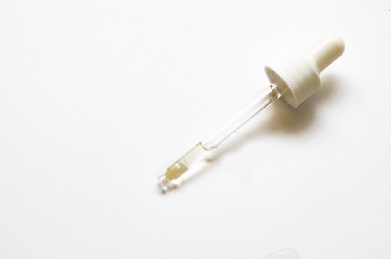 Acne skincare formula in dropper pipette 