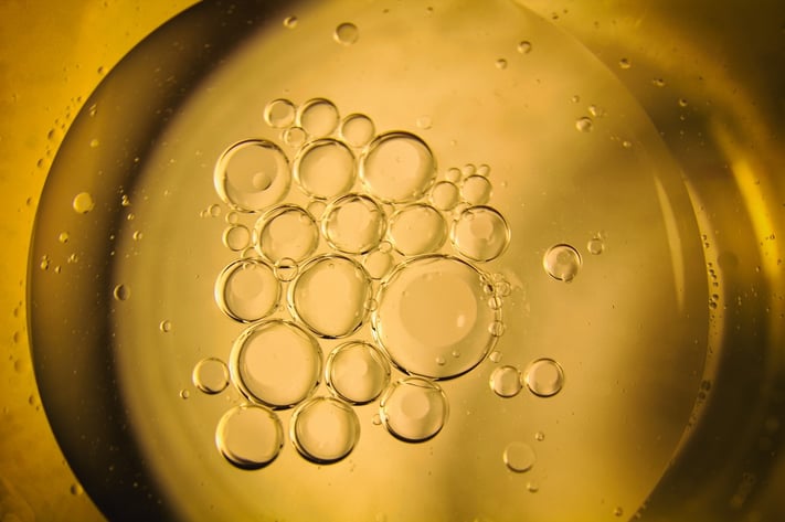 oil droplets to represent excess sebum production in oily skin