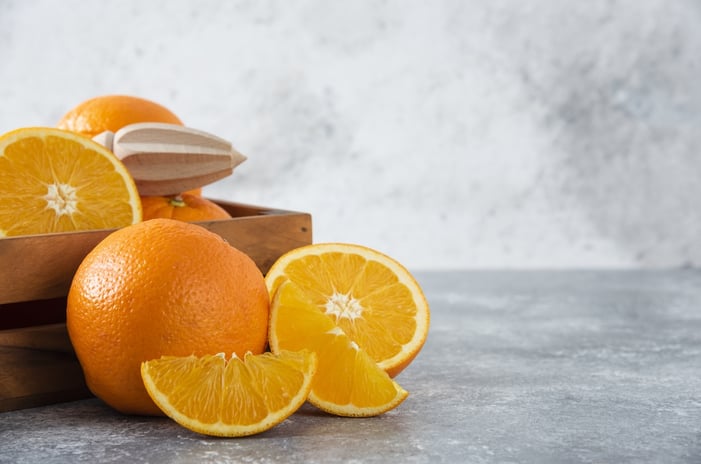 fresh oranges rich in Vitamin C to support skin firmness and help improve the appearance of pores