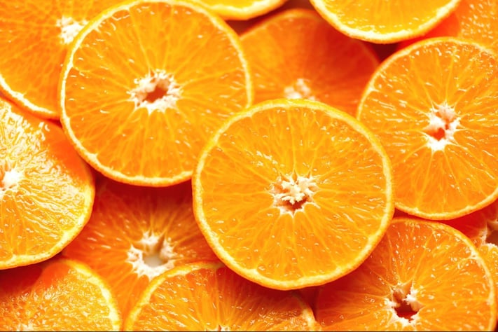 close up of fresh orange slices representing Vitamin C in skincare